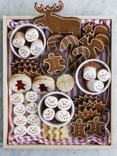 a wooden box filled with cookies and other treats