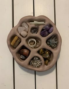 a bowl with rocks and stones in it