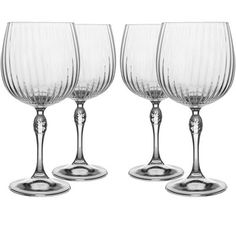 three wine glasses sitting next to each other