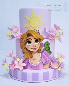 a cake with a princess on top and flowers around it