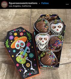 a box filled with chocolate covered treats on top of a wooden table