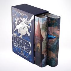 two books are opened in the shape of a book box with an image of a castle on it