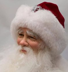 a close up of a person wearing a santa hat