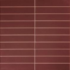 a red tile wall with horizontal lines on it