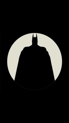 the dark knight silhouette in front of a full moon with batman's face on it