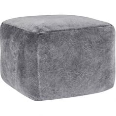 a large square ottoman that is made out of grey fabric and has a rounded shape