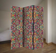 the room divider is decorated with multicolored squares