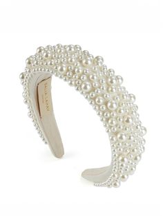 a white bracelet with pearls on it