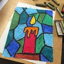 a drawing of a lit candle on paper with crayons next to it