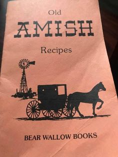 an old amish recipe book with a horse drawn carriage