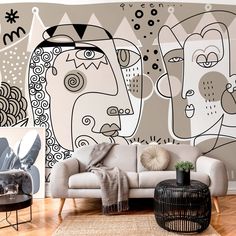 a living room scene with focus on the couch and wall mural behind it's sofa