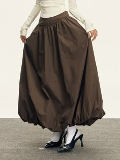 Discover the charm of effortless styling with our Flowy Maxi Bubble Skirt, a harmonious blend of function and fashion.

Expertly crafted from 100% polyamide fiber, this skirt exhibits a luxurious texture and offers a breezy A-line silhouette. The low-waist design and solid color provide a street-style aesthetic with European and American influences. Functional pockets add a practical touch to the skirt’s edgy yet sophisticated presence. 

Whether it's a casual day out or a special evening, pair Cool Evening Outfits, Structured Maxi Skirt, Casual Outfit With Skirt, Skirt Silhouettes, Street Wear Skirt, Coffee Clothes, Edgy Maxi Skirt Outfit, Winter Maxi Skirt, Vintage Flowy Maxi Skirt