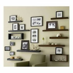 the wall is filled with pictures and frames