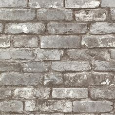 an old brick wall is shown in grey tones