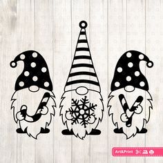 three gnomes with hats and snowflakes on them