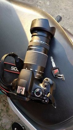 a camera sitting on the seat of a motorcycle