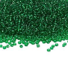 green seed beads on white background