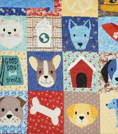 a patchwork quilt with dogs and cats on it's squares, all in different colors