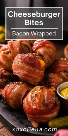 bacon wrapped cheeseburger bites on a plate with dipping sauce