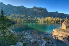 a mountain lake surrounded by rocks and trees