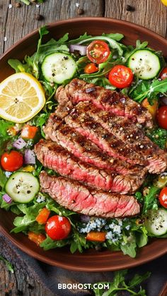 steak salad with tomatoes, cucumbers, and lettuce on a brown plate