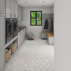 an empty laundry room with washers and dryer