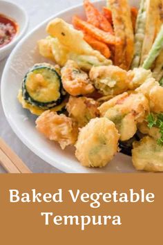 baked vegetable tempura on a white plate with chopsticks and dipping sauce