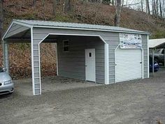 two cars are parked in front of a garage