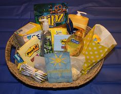 a basket filled with lots of items sitting on top of a blue cloth covered table