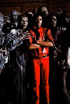 a man standing in front of a group of zombies