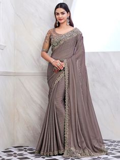 Our enchanting grey embroidered silk festival wear saree with blouse. This stunning ensemble is perfect for all your upcoming parties, events, and special occasions. The intricate sequin and embroidered work on both the saree and blouse add a touch of elegance and sophistication to your look. Made from high-quality silk fabric, this saree is not only stylish but also comfortable to wear all day long. This saree includes a 6.30-meter saree and unstitched blouse material, allowing you to customize Shimmer Saree, Sarees For Girls, Sequin Saree, Fancy Sarees Party Wear, Dusty Mauve, Party Wear Lehenga, Gray Silk, Wear Saree