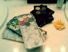 three different makeup products are sitting on the counter next to each other, including eyeshades and powders