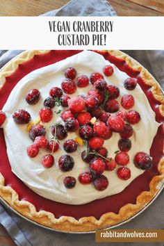 a pie topped with whipped cream and berries