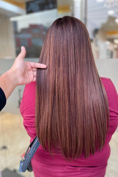 Woman with long straight brown hair highlighted with red and blonde. Pretty Brunette Hair, Red And Blonde Highlights, Brown Hair With Red, Red And Blonde