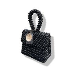 Artisanal Bead Bag.Designed in NYC. Crafted with precision in the heart of Lagos, Nigeria.Introducing our exclusive bead bags – the epitome of timeless elegance and craftsmanship. Chic, streamlined, and adaptable, these handbags are designed to be your enduring companions. Effortlessly blending style and durability, our bead bags transcend trends, seamlessly complementing cocktail dresses, casual denim and tees, professional attire, and becoming the perfect accessory for a night out on the town. Bead Bag, Lagos Nigeria, Professional Attire, Bag Light, Detail Shop, Beaded Bags, Casual Denim, Contemporary Fashion, Hand Beading