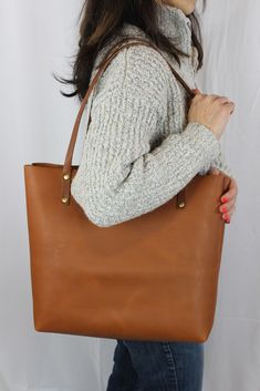 Handmade Leather Tote Bag Versatile Leather Bags With Leather Backing, Classic Large Shoulder Bag With Removable Pouch, Versatile Brown Shoulder Bag With Leather Backing, Versatile Brown Leather Backed Shoulder Bag, Brown Shoulder Bag With Long Handle For Daily Use, Fall Leather Tote Shoulder Bag, Leather Tote Shoulder Bag For Fall, Fall Shoulder Bag With Double Handle And Leather Lining, Classic Everyday Bags For Fall