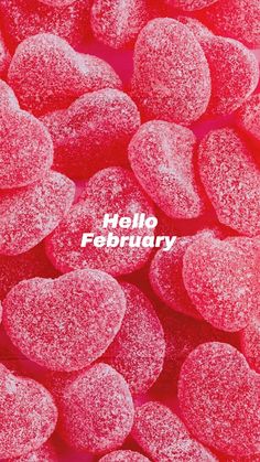 pink candy hearts with the words hello february written on them in white text over a red background