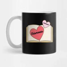 a black and white coffee mug with two hearts on it, reading i love christmas