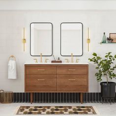 a bathroom with two mirrors above the sink and a rug on the floor next to it