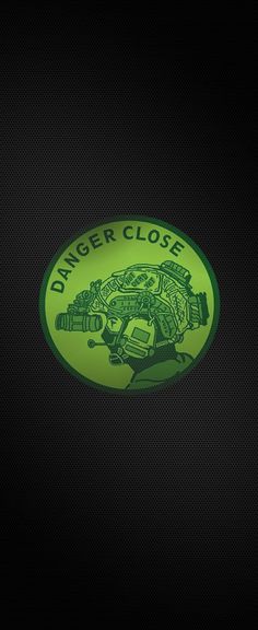 a neon green sticker with the words danger close on it's back side