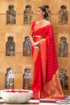 Product Description: Enhance your traditional wardrobe with this stunning pure Kanjivaram silk saree, designed for special occasions like weddings, festivals, and celebrations. This rich, handwoven saree comes in an eye-catching vibrant red shade, adorned with intricate gold zari work that adds a regal touch. The saree features delicate floral and paisley motifs, expertly crafted by skilled artisans, making it a perfect choice for a bridal or festive look. The saree drapes beautifully and is lightweight, offering a luxurious feel while maintaining comfort. The rich border and pallu enhance the overall elegance of the saree, making you stand out in any gathering. Pair it with traditional jewelry to complete your elegant and timeless appearance. - Material : Pure Kanjivaram Silk - Color : Re Saree With Belt, Kanjivaram Sarees Silk, Chique Outfits, Party Kleidung, Art Silk Sarees, Red Saree, Kanjivaram Sarees, Wear Saree, Saree Look