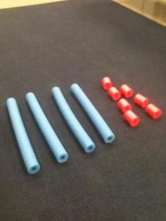 several blue and red plastic objects sitting on a black surface next to each other,