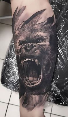 a man's arm with an angry gorilla tattoo on it