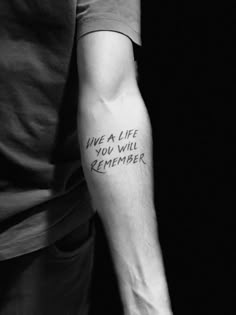 a man with a tattoo on his arm that says, i've a life you will remember