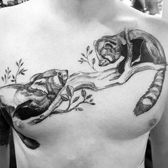 black and white photo of man with animal tattoo on chest