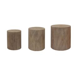 three wooden stools sitting next to each other