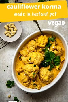 a white bowl filled with cauliflower and cashews