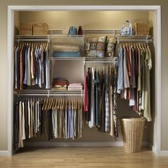 an organized closet with clothes and baskets