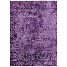 a purple rug with an abstract design