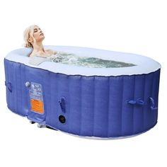 an inflatable hot tub with a woman sitting inside